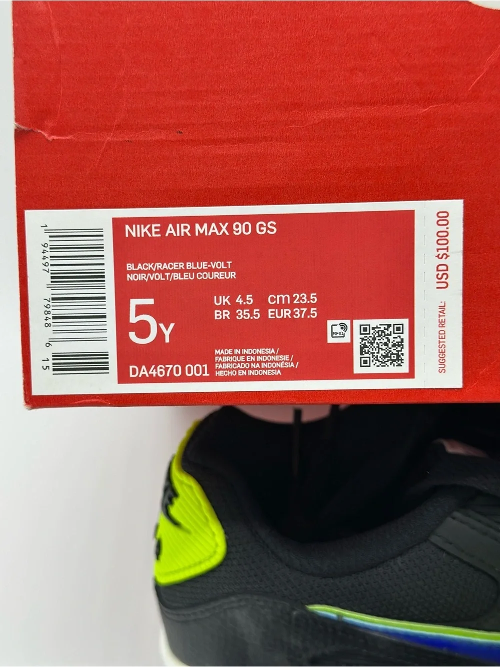 Nike Kids Black Sneakers with Neon Yellow and Blue Swoosh